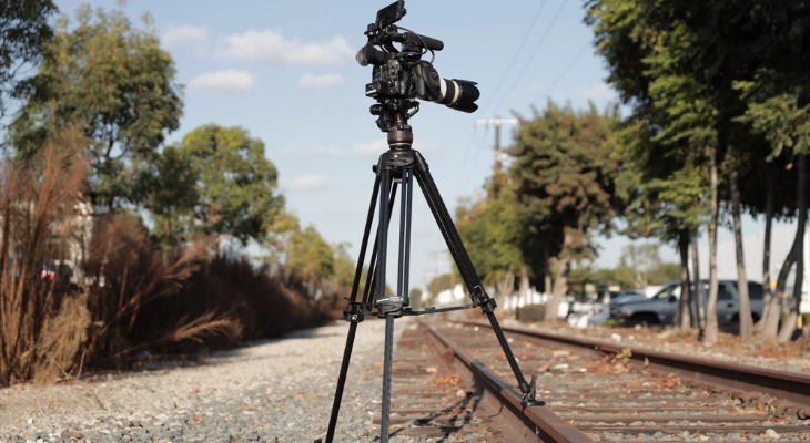 A tripod with adjustable legs keep the camera in a stable position for taking product photos