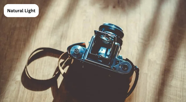 A stylish camera on a table, improved by natural light, showcases the inviting warmth of the wood.