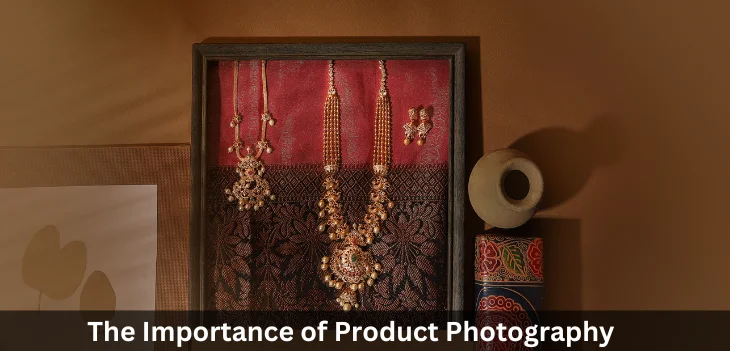 An antique necklace with earrings set on a saree exhibits the best jewellery photography services