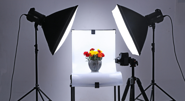 Photography setup with studio lights & background for capturing high-quality product images.