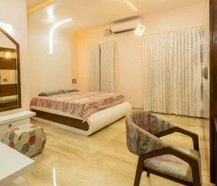 Bedroom showcasing a comfortable bed, stylish dresser, creating a serene ambiance captured by a talented photography.